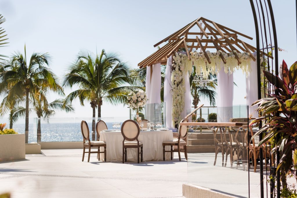 Elegant oceanfront wedding setup at Terraza La Vista, Secrets Vallarta Bay, an all-inclusive Four Diamond resort in Puerto Vallarta, Mexico—featured by Breezy Brides.