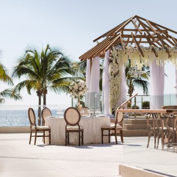 Elegant oceanfront wedding setup at Terraza La Vista, Secrets Vallarta Bay, an all-inclusive Four Diamond resort in Puerto Vallarta, Mexico—featured by Breezy Brides.