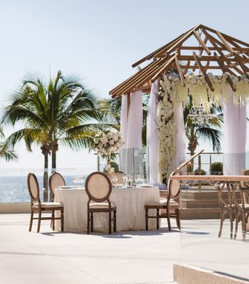 Elegant oceanfront wedding setup at Terraza La Vista, Secrets Vallarta Bay, an all-inclusive Four Diamond resort in Puerto Vallarta, Mexico—featured by Breezy Brides.